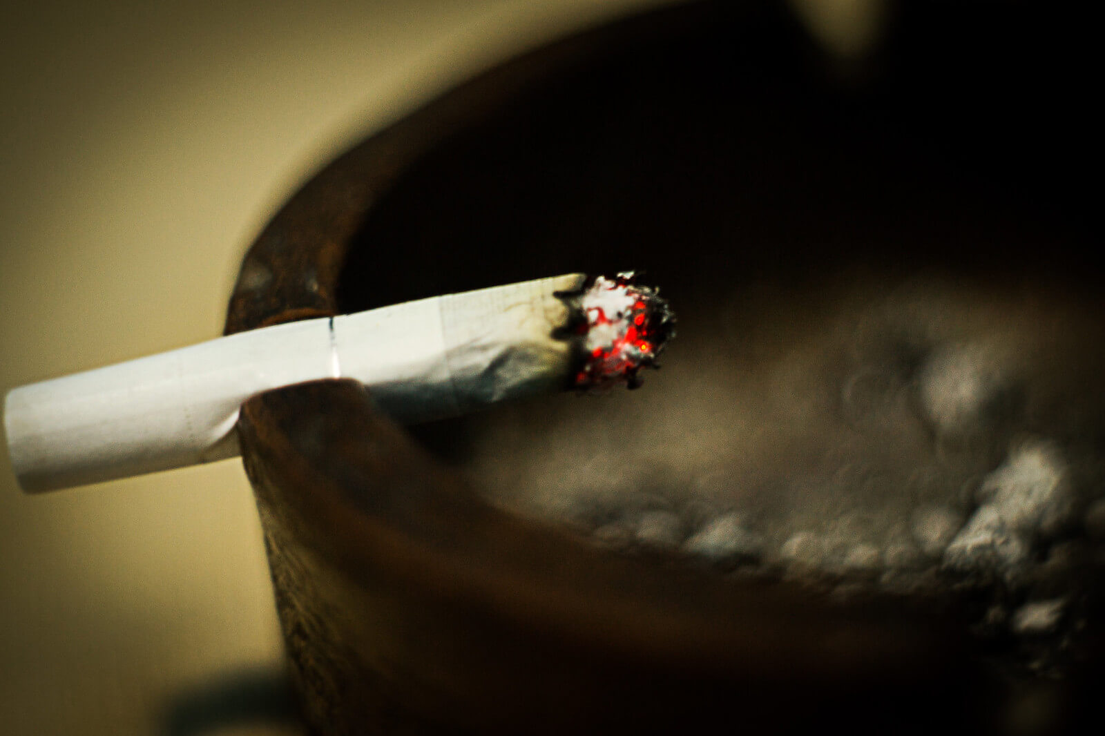 lit cigarette in ashtray