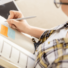 Woman writing in a notebook